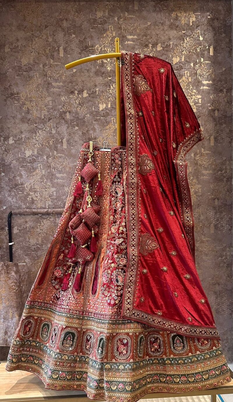 Red and baby pink hand embroidered velvet bridal lehenga